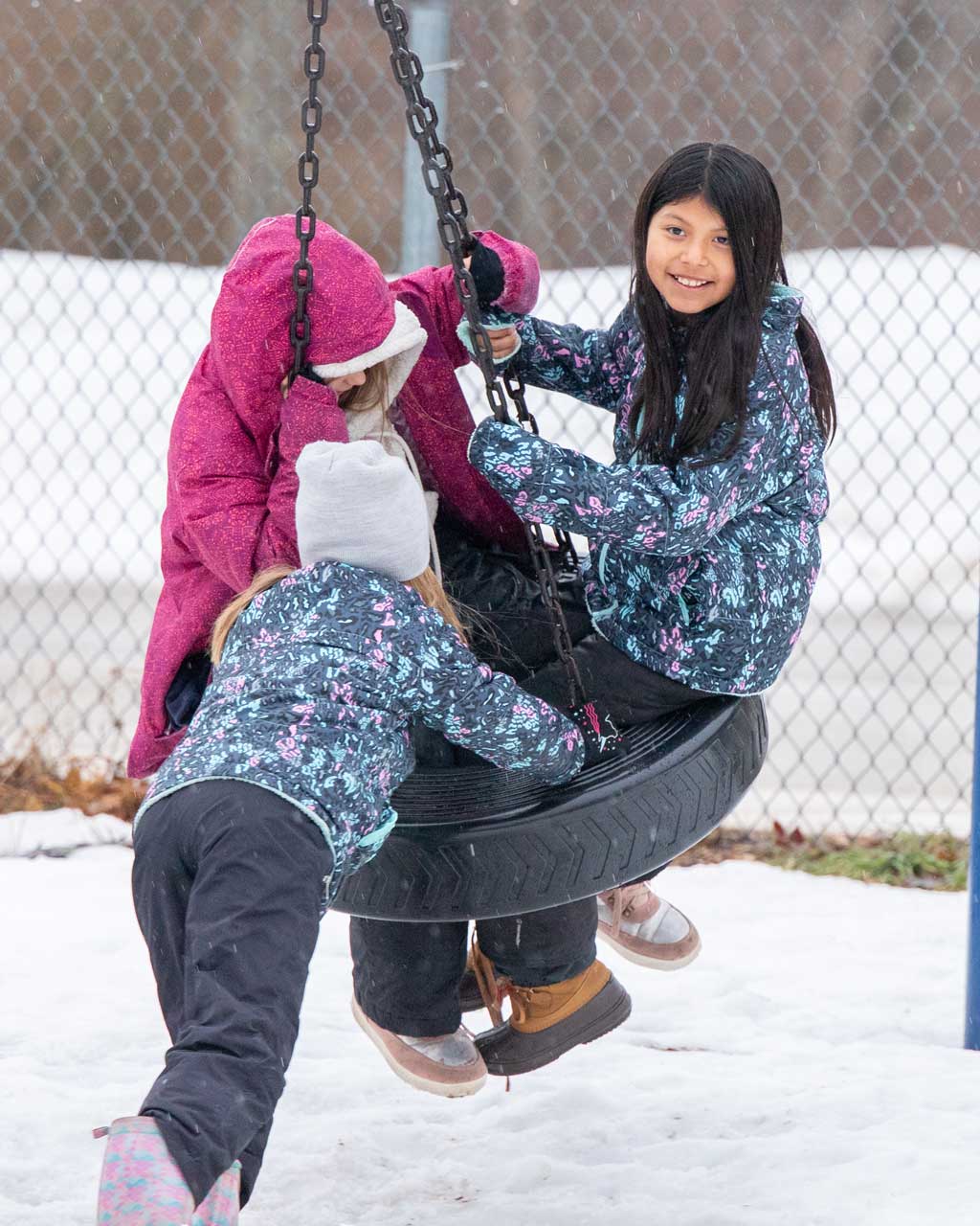 girls-on-tire-swing-portrait