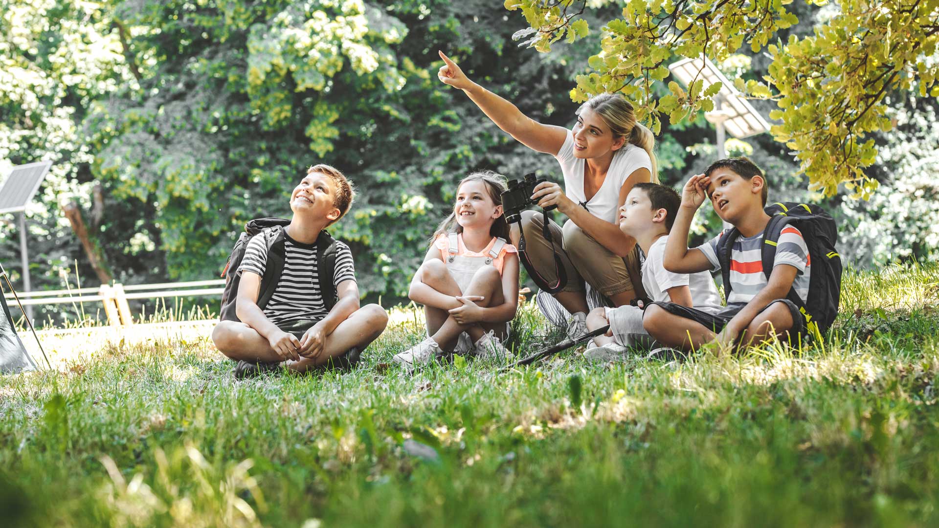 teacher-with-students-outdoors