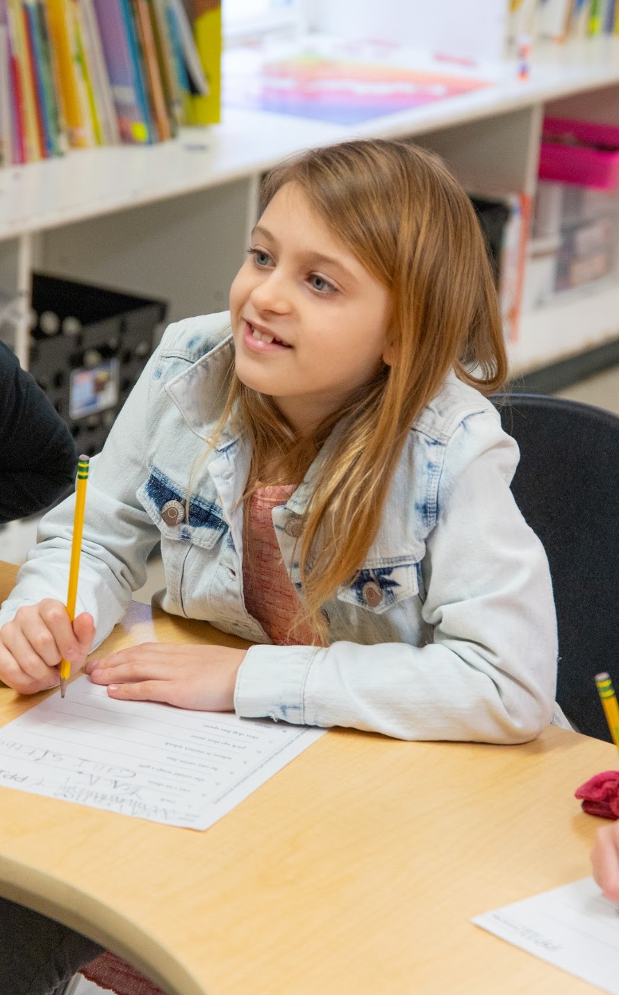Smiling girl learning